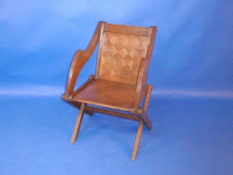 A Pugin design Glastonbury chair with parquetry backed panel with plaque Howard's patent