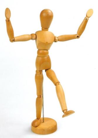 A light wood Studio style artist's figure sculpture