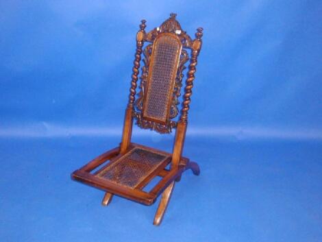 A Victorian beech folding chair in the Jacobean style with barley twist uprights