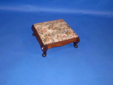 A Victorian mahogany stool with tapestry drop in seat and short cabriole legs