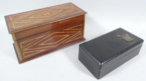 An early 20thC mahogany and partial inlaid jewellery casket