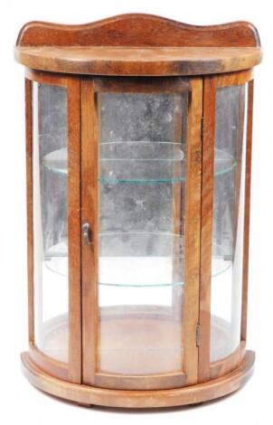 A mid 20thC oak stained hanging display cabinet