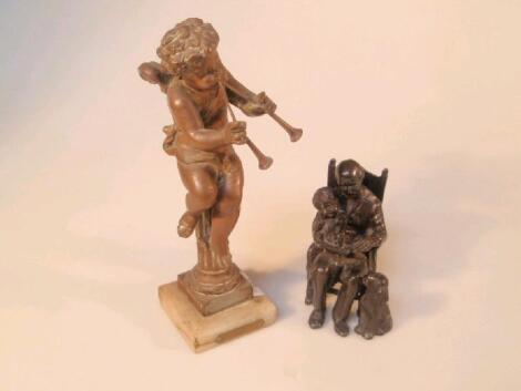 A 19thC French bronze figure of a winged cherub with pipes seated on a column