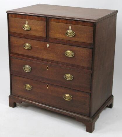 An early 19thC oak and mahogany chest