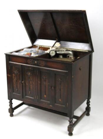 A mid 20thC oak cased Gilbert record player