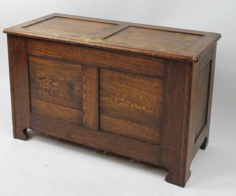 A 20thC oak two panelled coffer