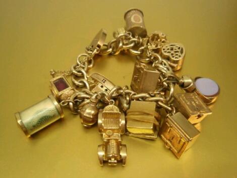 A 9ct gold charm bracelet with assorted gold and other charms