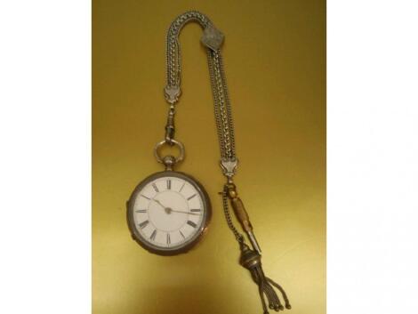 A Victorian silver cased open faced pocket watch with enamelled dial and chased case