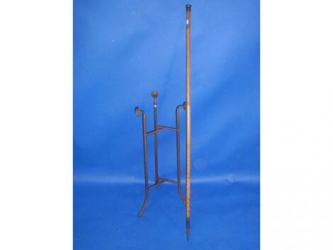 A brass tripod stand and a brass knopped Victorian ranging cane