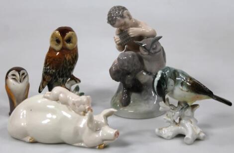 A Royal Copenhagen figure of Pan seated aside an owl