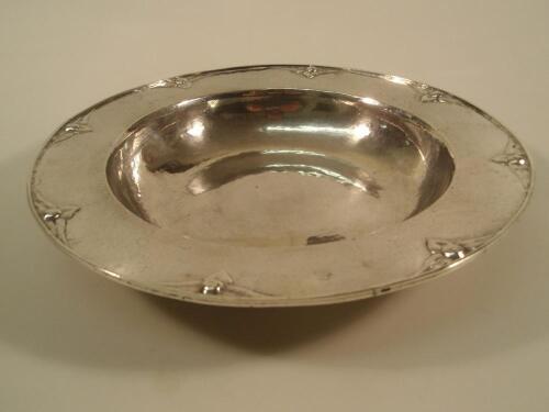 A Guild of Handicraft Ltd planished silver dish