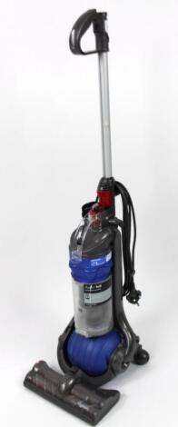 A Dyson DC24 upright electric vacuum cleaner