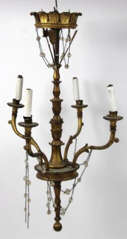 A 19thC four branch gilt wood chandelier