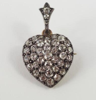 A diamond set heart shaped pendant brooch