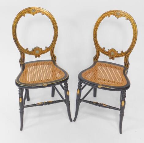 A pair of Victorian papier mache and gilt decorated salon chairs