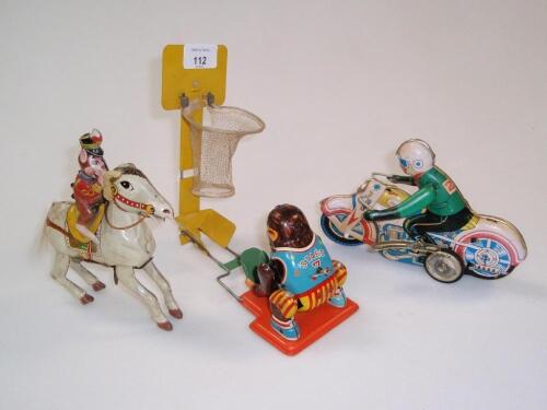 Three tin plate clockwork toys including motor cyclist