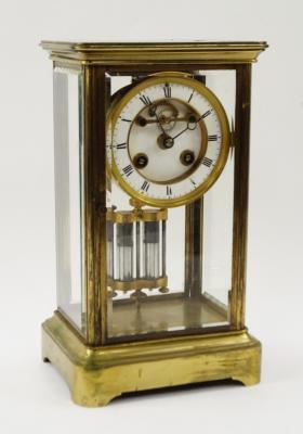 A French brass and faceted glass sided mantel clock