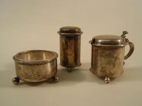 A George V silver cruet set comprising mustard