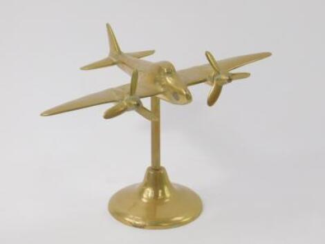 A brass desk stand modelled as a twin propeller military aircraft