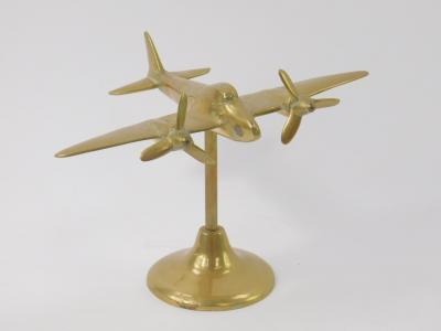 A brass desk stand modelled as a twin propeller military aircraft