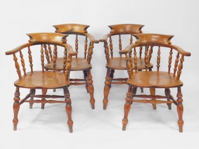 A set of four Victorian oak smoker's bow chairs