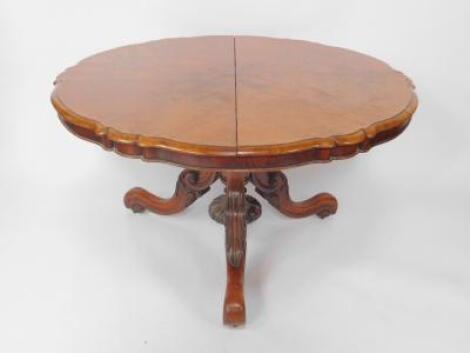 A Victorian walnut circular piecrust tilt top breakfast table