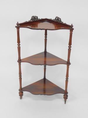 A Victorian rosewood three tier corner whatnot