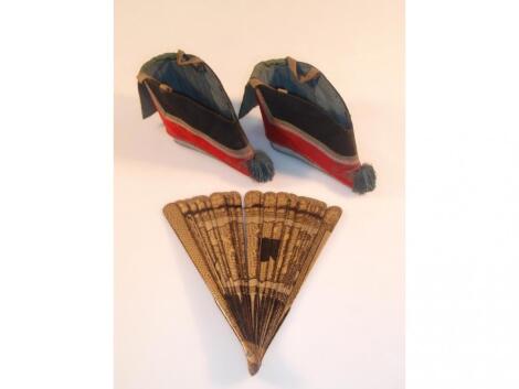 A pair of Chinese silk shoes with tassel toes