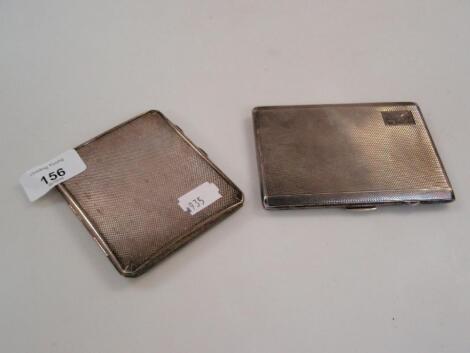 Two machine turned silver cigarette cases