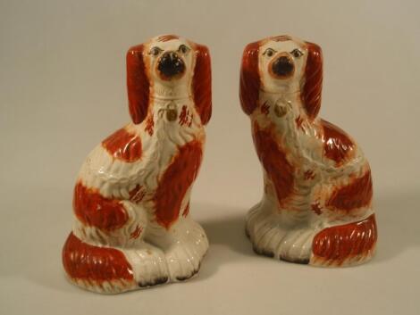 A pair of Staffordshire pottery spaniels