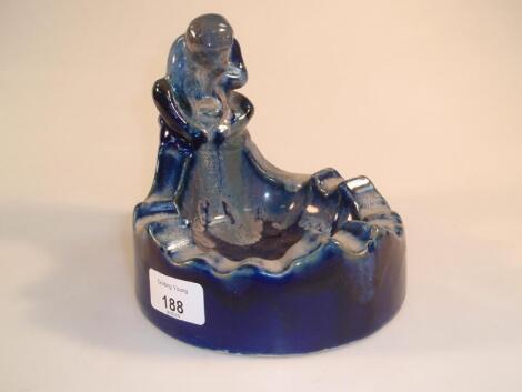 An Art Pottery ashtray modelled with a seated monkey to the side