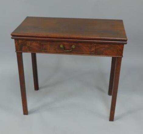 A George III mahogany foldover tea table