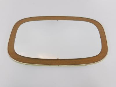 A late 20thC teak effect and brass bound oblong wall mirror.