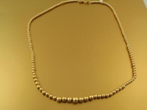 An 18ct gold graduated bead necklace