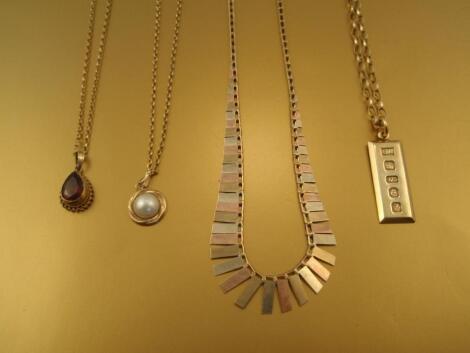 Three 9ct gold pendant necklaces and a tricolour brickette necklace