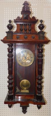 A Continental walnut and oak cased wall clock