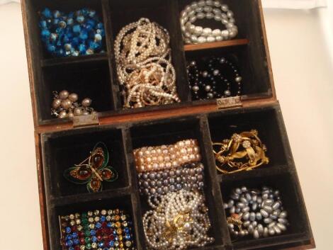 A walnut dome topped jewellery box and contents of costume jewellery