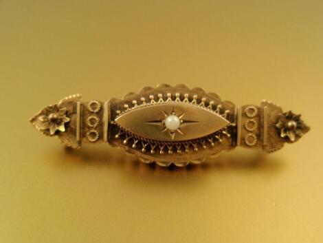 A Victorian panel brooch set with a central seed pearl