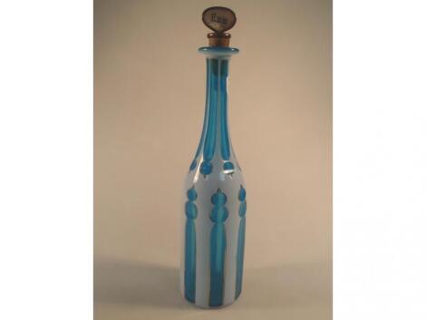 A 19thC blue overlaid decanter with faceted neck