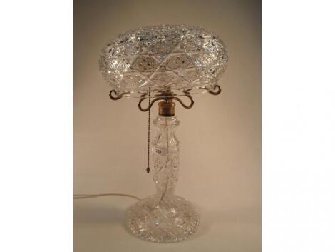 A cut glass table lamp with mushroom shade