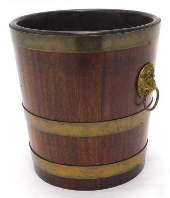 A 19thC mahogany and brass coopered waste paper basket or jardiniere