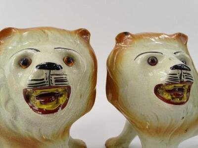 A pair of mid 19thC English pottery figures of standing lions - 2