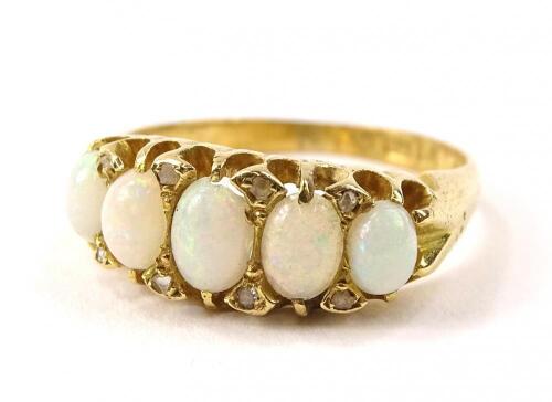 An 18ct gold five stone opal dress ring