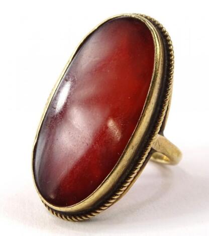 A 9ct gold orange agate stone set dress ring