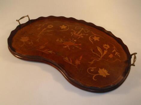 An Edwardian mahogany kidney shaped two-handled tray inlaid with floral scrolls