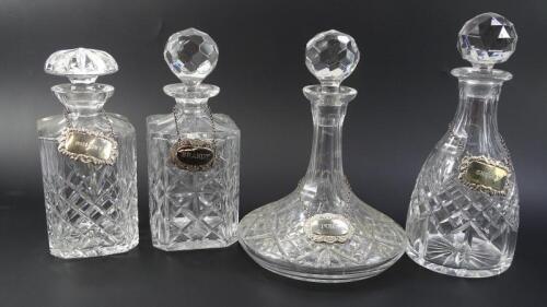 Four various cut glass decanters