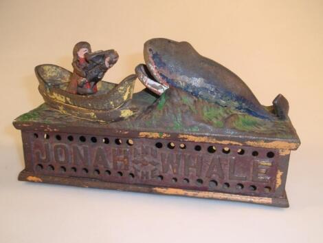 A cast iron Jonah and the Whale mechanical money box