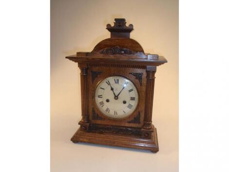 A late 19thC German mantel clock of eight-day movement striking on a gong