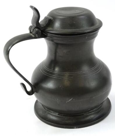 A lidded pewter quart tankard