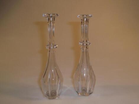 A pair of early 19thC toddy lifters with faceted annulated bodies